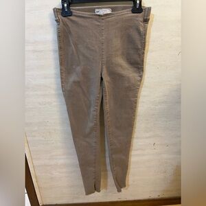 Free People Easy Does It Denim Leggings in a khaki color.